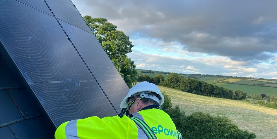 Background image a man installing solar panels